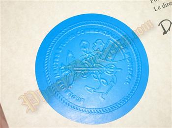 Fake diploma blue embossed emblem